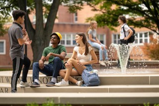York College students gathered by the fountain on campus.